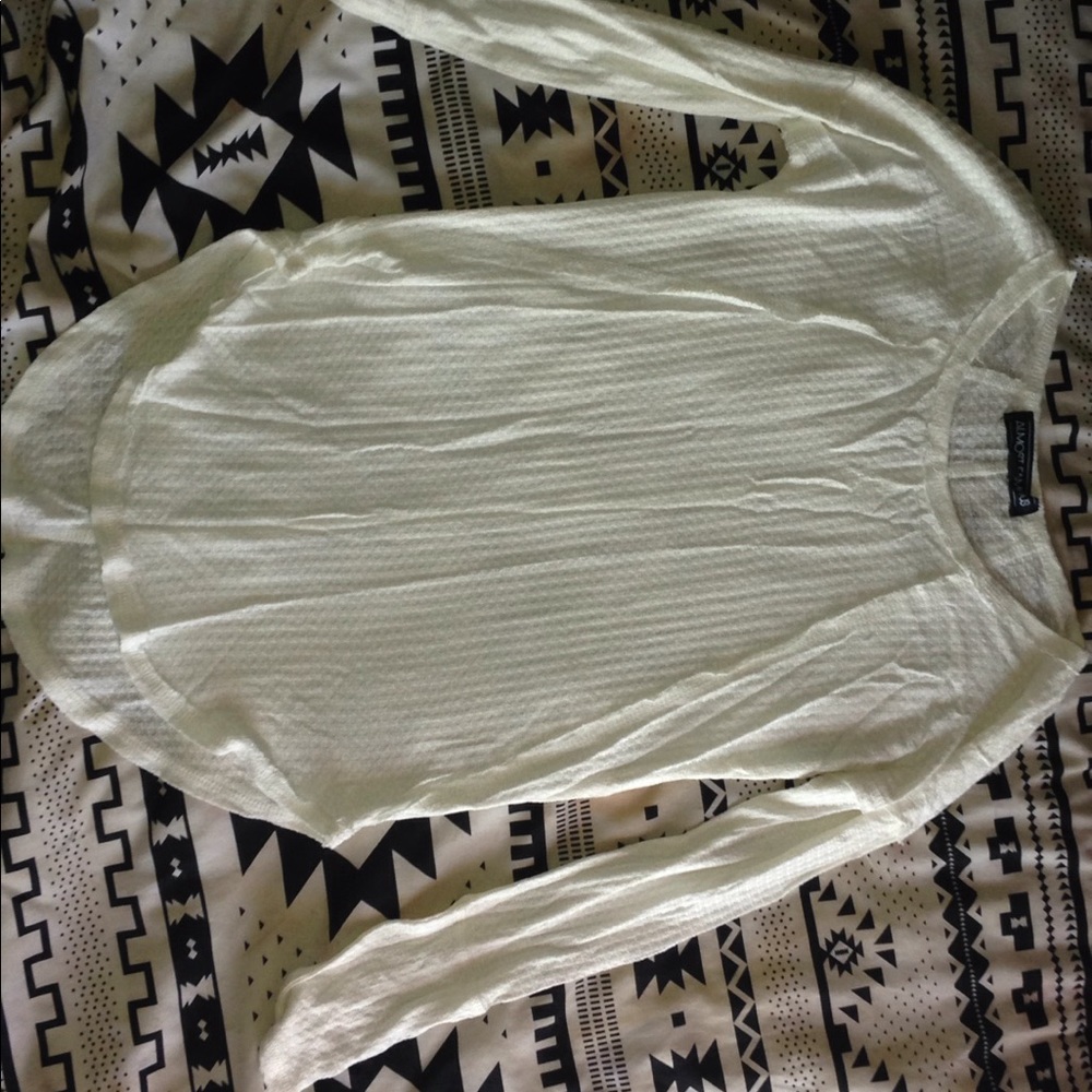 Long sleeve white top.